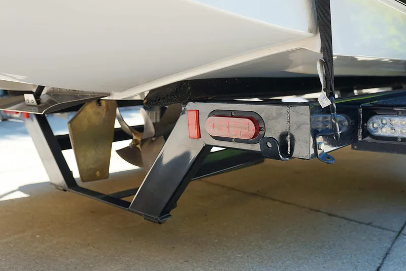 Slide: The Image of 2014 Tigé R20 boat trailer hitch and propeller detail. - 48