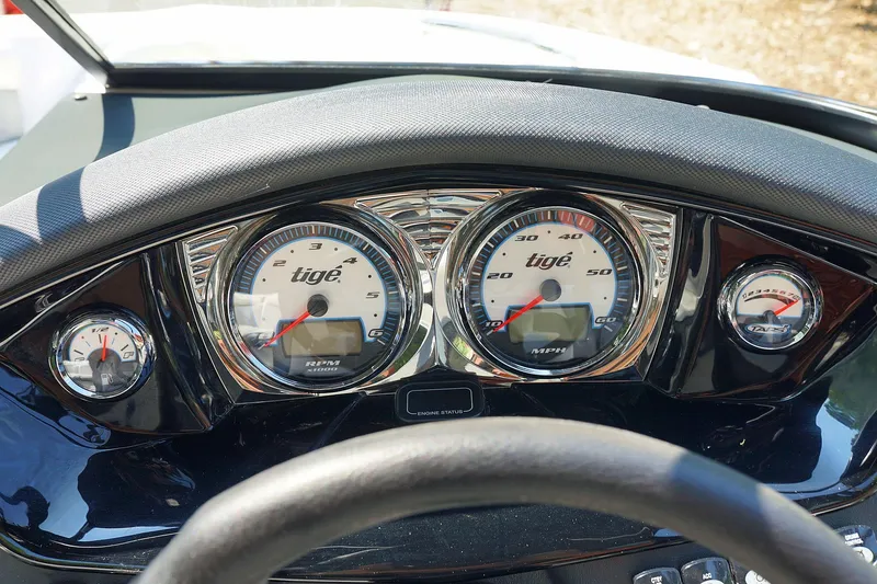 Slide: The Image of Dashboard of a 2014 Tigé R20 boat with speedometer and gauges. - 5