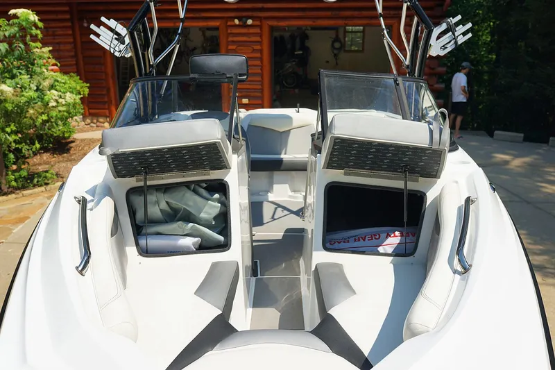 Slide: The Image of 2014 Tigé R20 boat interior with open storage compartments and sleek design. - 6