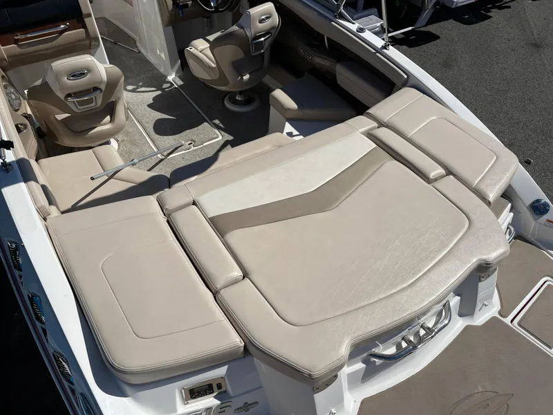 Slide: The Image of 2012 Chaparral 216 SSi boat interior with beige seating and modern design. - 8