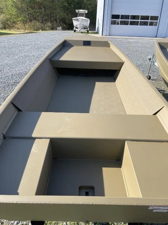 Slide: The Image of 2025 G3 1548VBW boat with floor, parked outside a garage. - 3