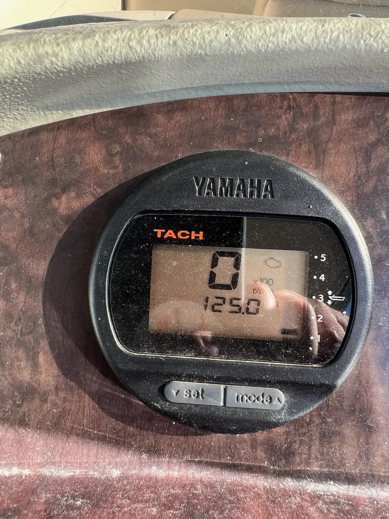 Slide: The Image of Yamaha tachometer display on 2008 Premier 310 Boundary Waters boat dashboard. - 11