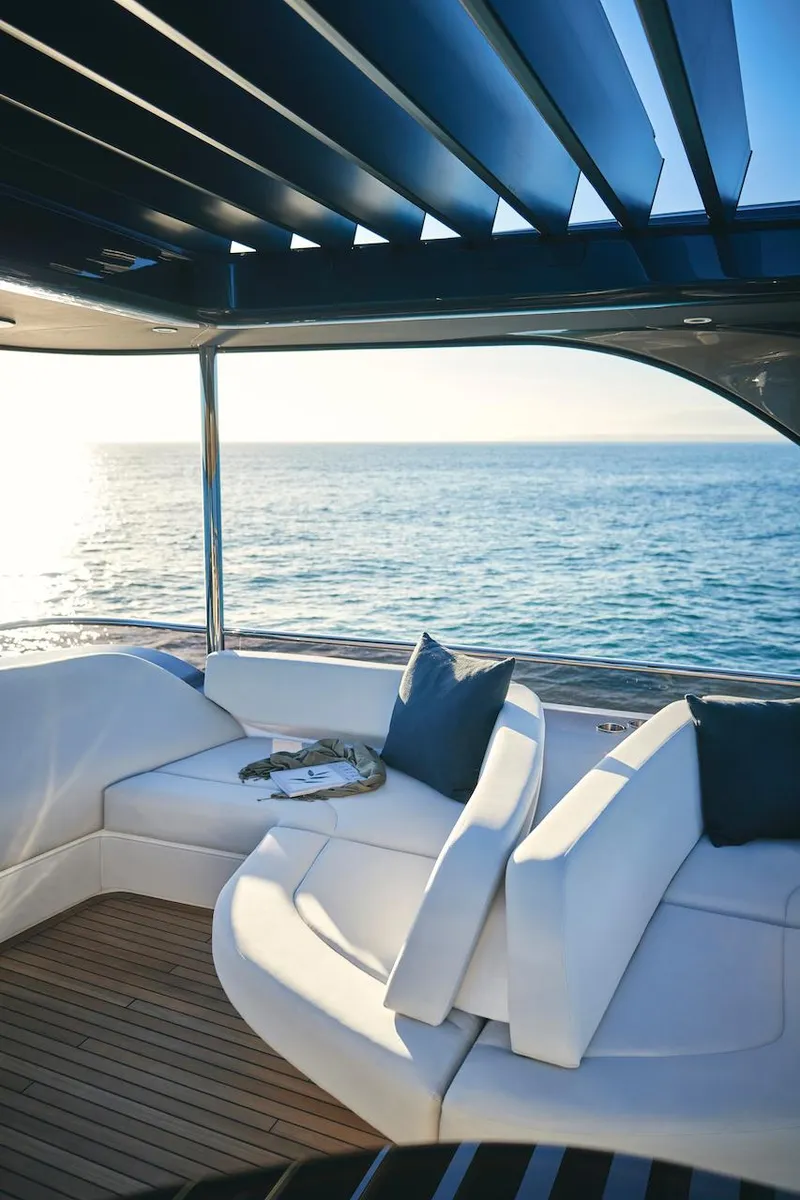 Slide: The Image of Luxurious 2025 Princess Y72 Motor Yacht with elegant seating and ocean view. - 11