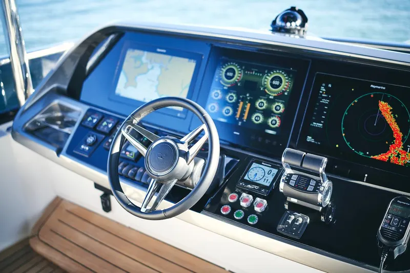 Slide: The Image of Cockpit of 2025 Princess Y72 Motor Yacht with advanced navigation displays. - 16