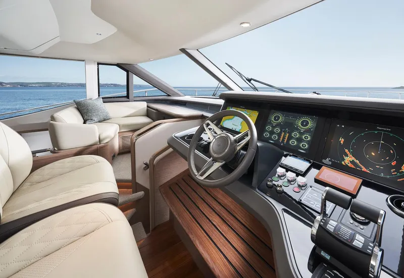 Slide: The Image of Luxurious 2025 Princess Y72 Motor Yacht helm with advanced navigation systems and plush seating. - 18