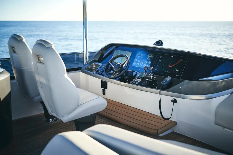 Slide: The Image of Luxurious 2025 Princess Y72 Motor Yacht cockpit with modern navigation system. - 19
