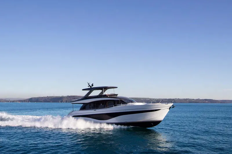 Slide: The Image of 2025 Princess Y72 Motor Yacht cruising on open water. - 2