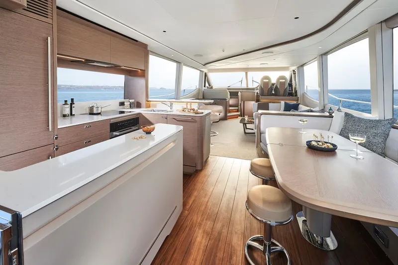 Slide: The Image of Luxurious interior of 2025 Princess Y72 Motor Yacht with modern kitchen and dining area. - 22