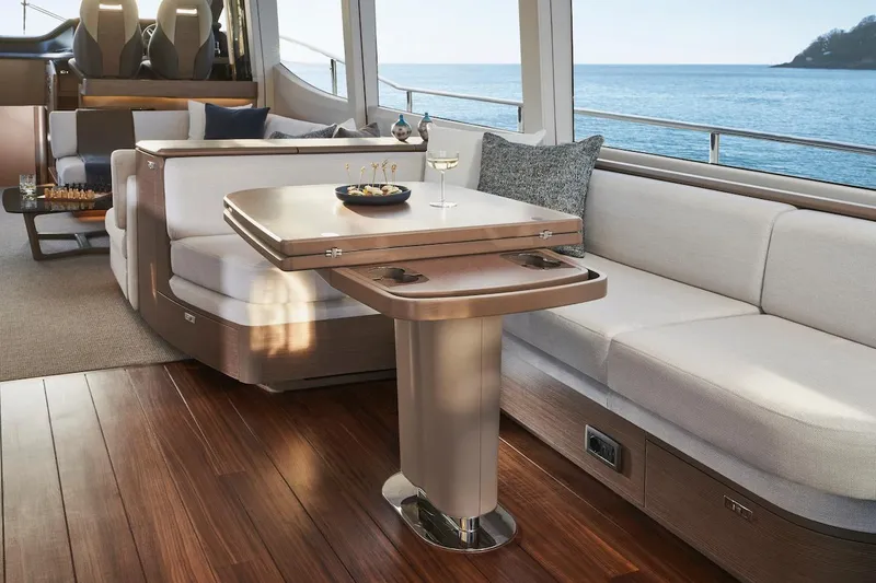 Slide: The Image of Luxurious interior of 2025 Princess Y72 Motor Yacht with elegant seating and ocean view. - 25