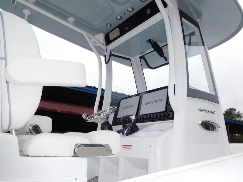 Slide: The Image of 2025 Sea Hunt Ultra 265 SE boat interior with Garmin navigation system. - 4