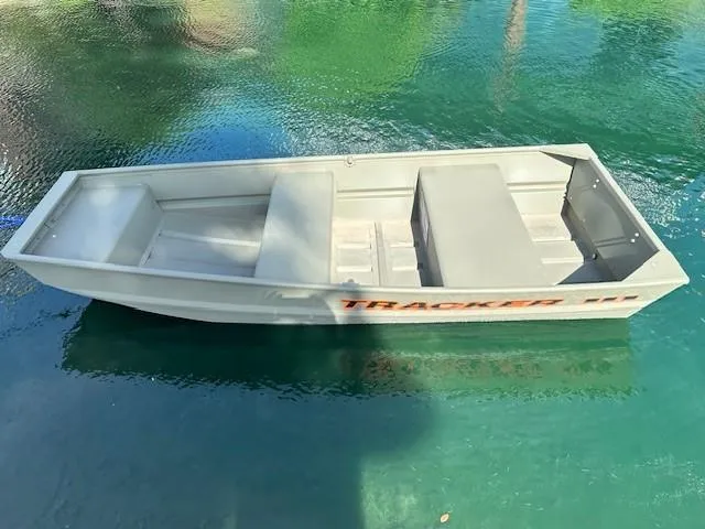 The Image of 2025 Tracker Grizzly 1036 Utility boat on clear water. - 0