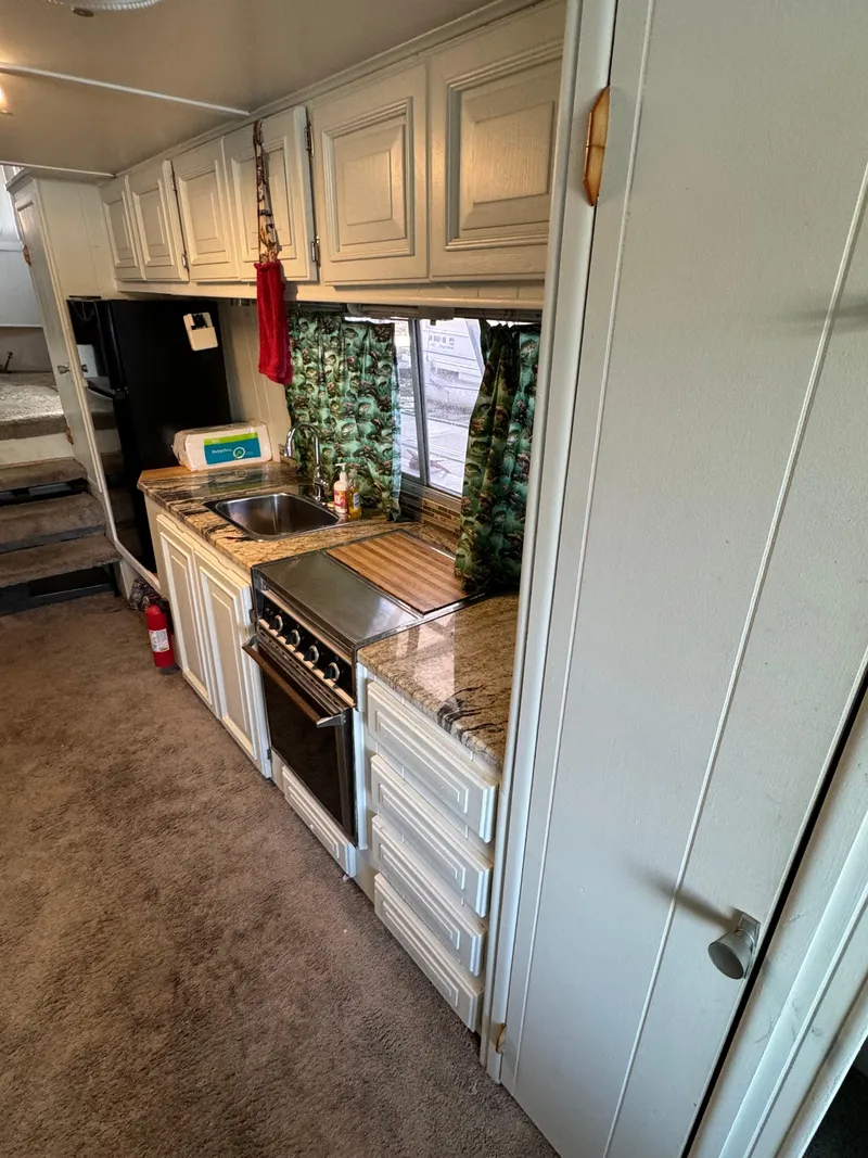 Slide: The Image of 1979 Nauta-Line Nautaline kitchen interior with stove, sink, and cabinets. - 12