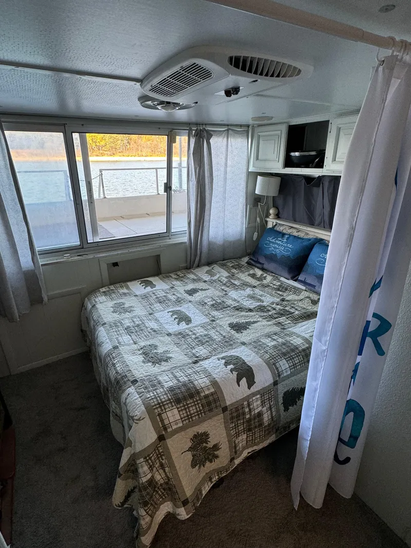 Slide: The Image of Cozy bedroom in a 1979 Nauta-Line Nautaline boat with lake view. - 13