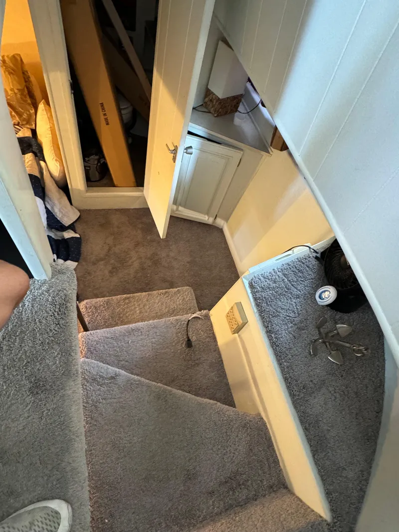 Slide: The Image of Interior of a 1979 Nauta-Line Nautaline with carpeted stairs and storage area. - 14