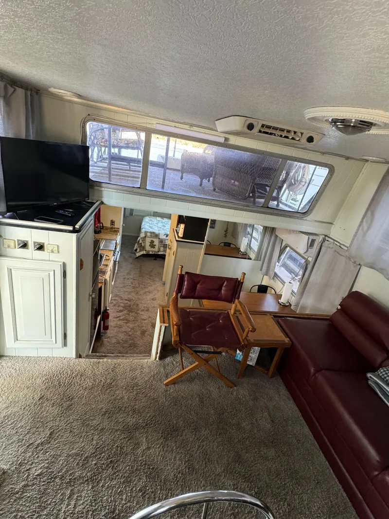 Slide: The Image of Interior of a 1979 Nauta-Line Nautaline houseboat with cozy seating and a TV. - 17