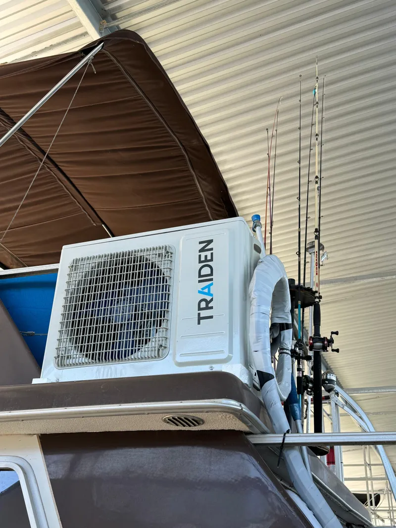 Slide: The Image of 1979 Nauta-Line Nautaline boat with Traiden air conditioning unit and fishing rods. - 21