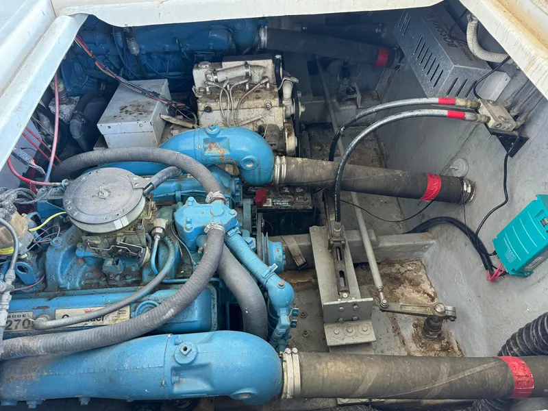 Slide: The Image of Engine compartment of a 1979 Nauta-Line Nautaline boat, showcasing mechanical components and wiring. - 22