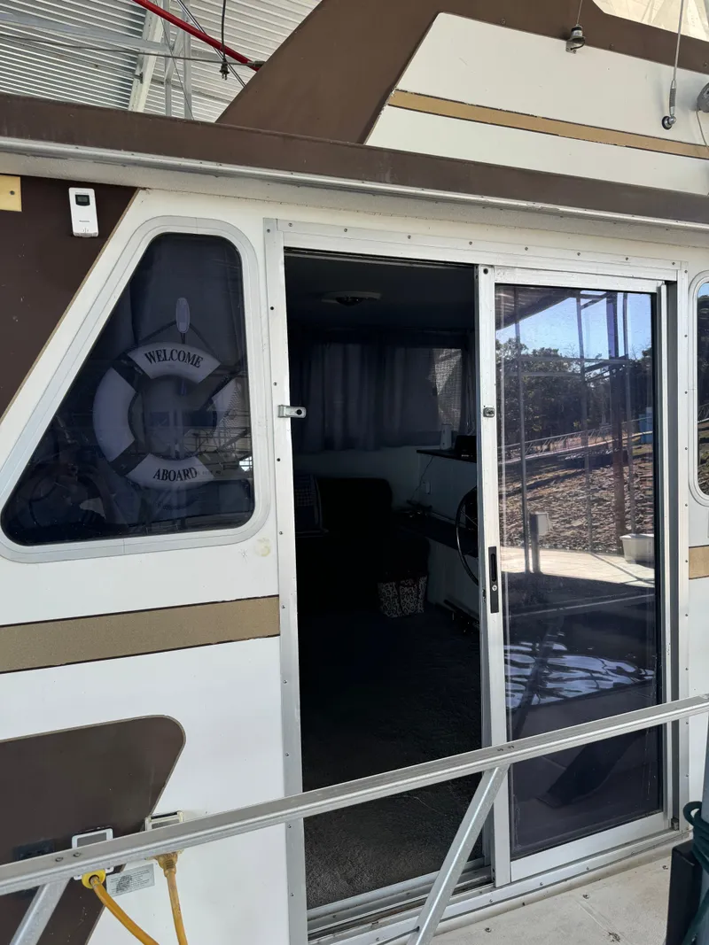 Slide: The Image of 1979 Nauta-Line Nautaline boat with open sliding door and "Welcome Aboard" sign. - 3