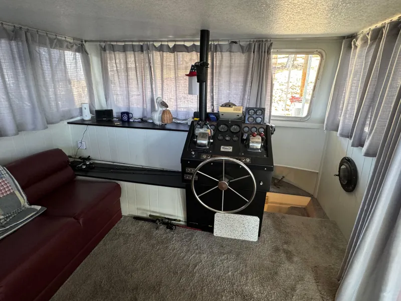 Slide: The Image of Interior of a 1979 Nauta-Line Nautaline boat with helm, sofa, and windows. - 5