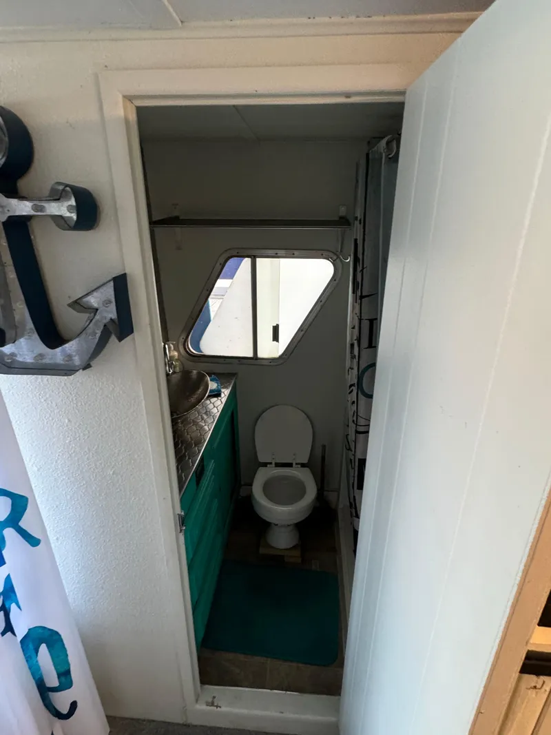 Slide: The Image of 1979 Nauta-Line Nautaline bathroom with teal accents and nautical decor. - 6
