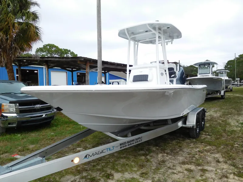 The Image of 2025 Tidewater 2210 Carolina Bay boat on trailer, parked outdoors. - 1
