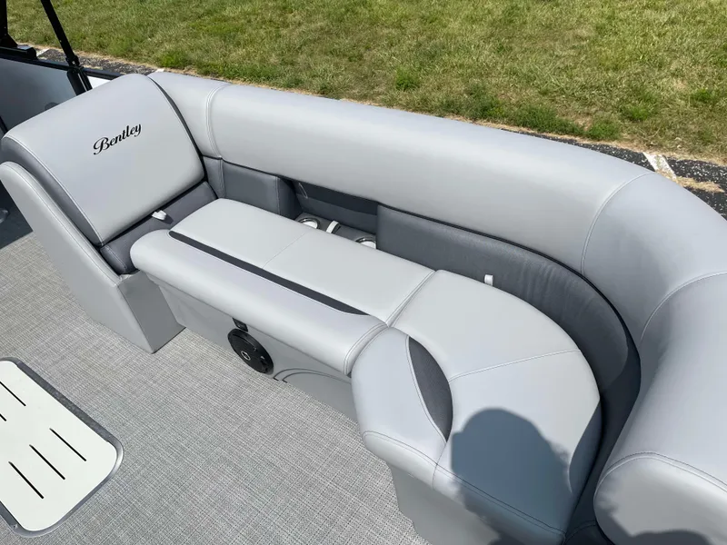Slide: The Image of 2025 Bentley Pontoons Legacy 243 Swingback interior with luxurious gray seating. - 10