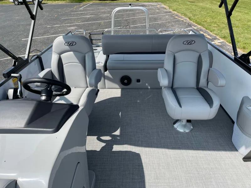 Slide: The Image of 2025 Bentley Pontoons Legacy 243 Swingback interior with plush seating and modern design. - 14