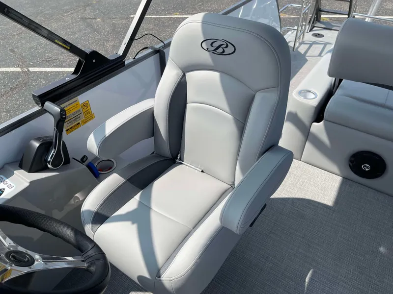 Slide: The Image of 2025 Bentley Pontoons Legacy 243 Swingback captain's chair, luxurious gray upholstery, sleek design. - 17