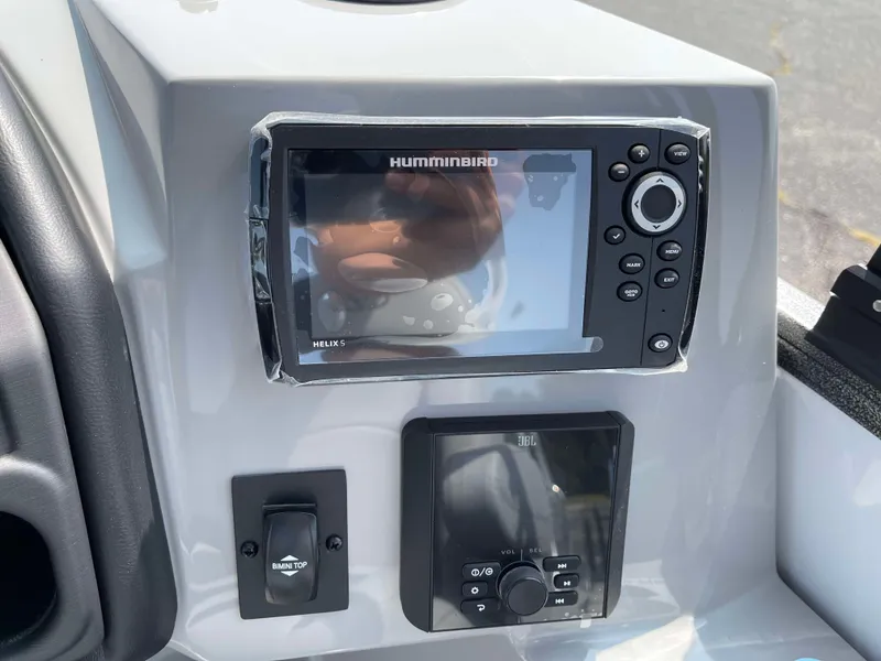 Slide: The Image of 2025 Bentley Pontoons Legacy 243 Swingback dashboard with Humminbird navigation system. - 23
