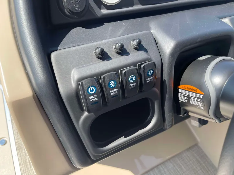 Slide: The Image of Control panel of 2025 Bentley Pontoons Legacy 223 QSB with power switches. - 16