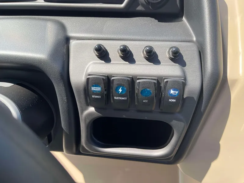 Slide: The Image of Control panel of 2025 Bentley Pontoons Legacy 223 QSB with labeled switches. - 18