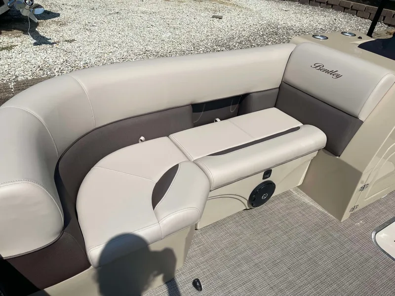 Slide: The Image of 2025 Bentley Pontoons Legacy 223 QSB interior seating with beige upholstery. - 8