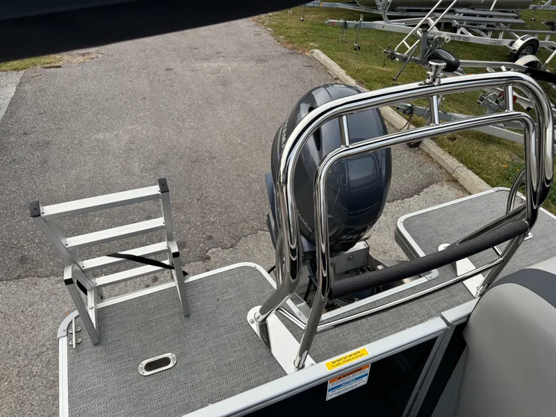 Slide: The Image of Sweetwater 2086 BF 2025 boat with motor and ladder on deck. - 10