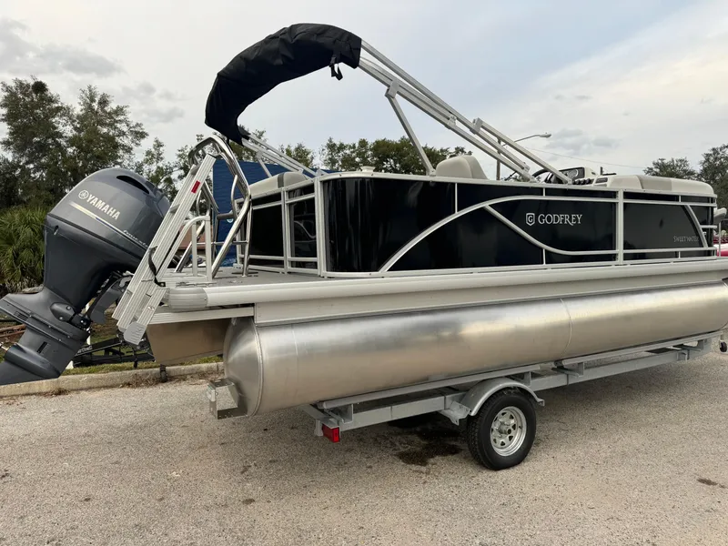Slide: The Image of 2025 Sweetwater 2086 BF pontoon boat with Yamaha engine on trailer. - 2