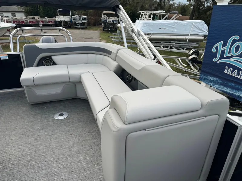 Slide: The Image of Sweetwater 2086 BF 2025 pontoon boat with gray seating and carpeted deck. - 5