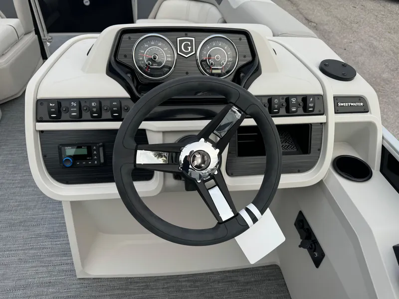Slide: The Image of Steering console of 2025 Sweetwater 2086 BF boat with modern controls and gauges. - 6