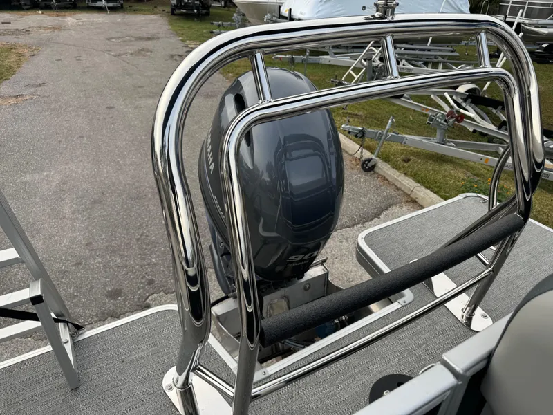 Slide: The Image of Sweetwater 2086 BF 2025 boat with chrome railing and outboard motor. - 9