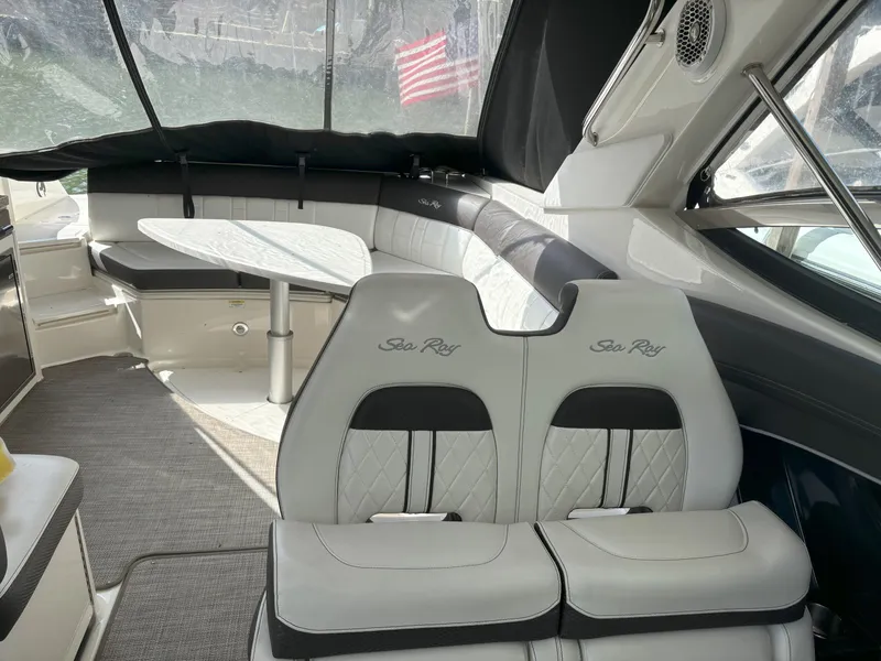 Slide: The Image of Interior of 2016 Sea Ray 350 SLX boat with seating and table. - 10