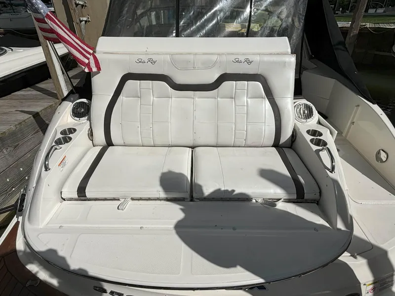 Slide: The Image of 2016 Sea Ray 350 SLX boat with white leather seating and American flag. - 15
