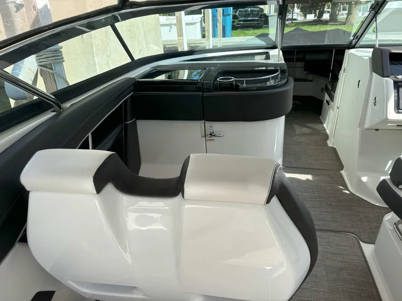 Slide: The Image of Interior of 2016 Sea Ray 350 SLX boat with sleek seating and modern dashboard. - 22