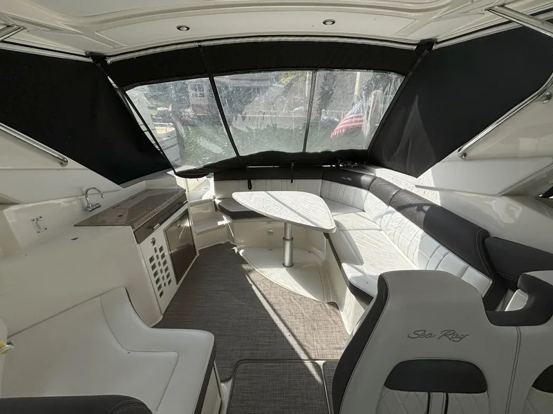 Slide: The Image of Interior of 2016 Sea Ray 350 SLX boat with seating and table. - 3