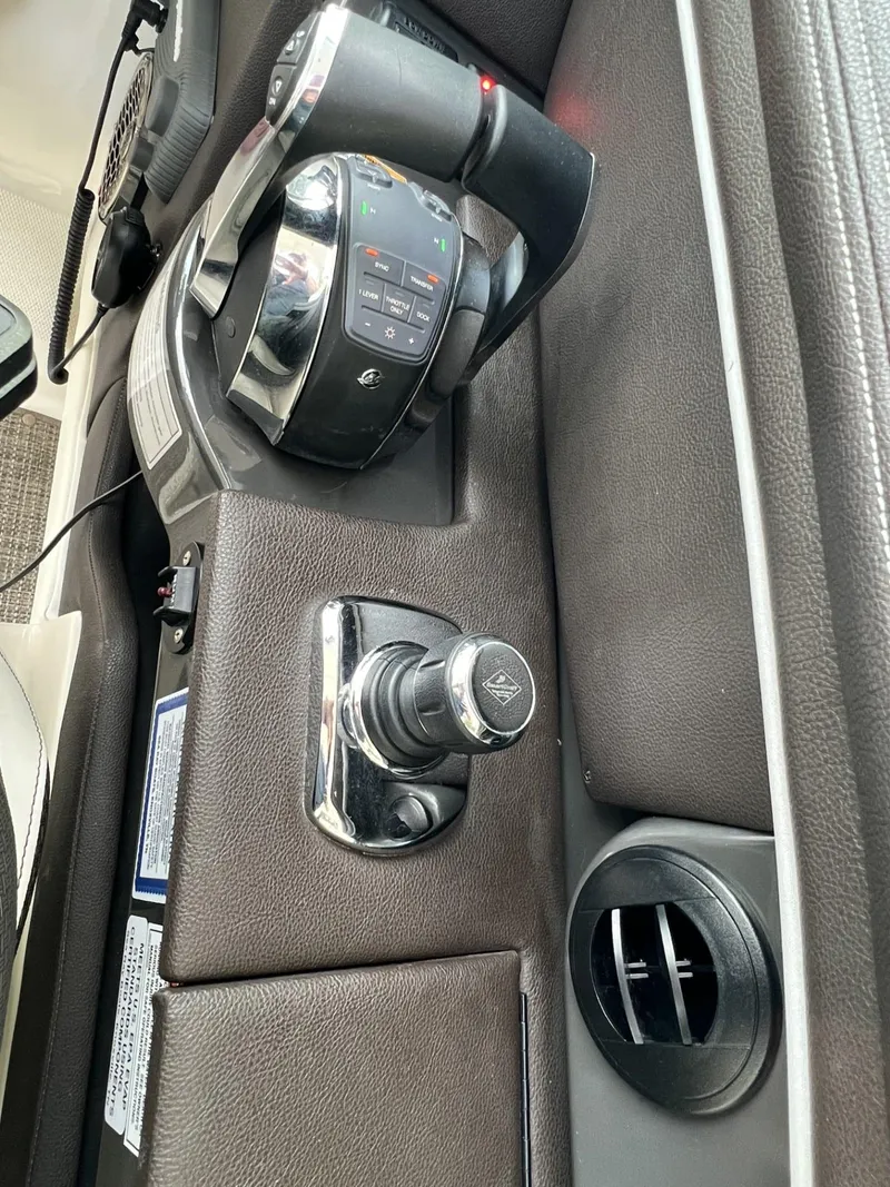 Slide: The Image of 2016 Sea Ray 350 SLX boat controls and dashboard details. - 5