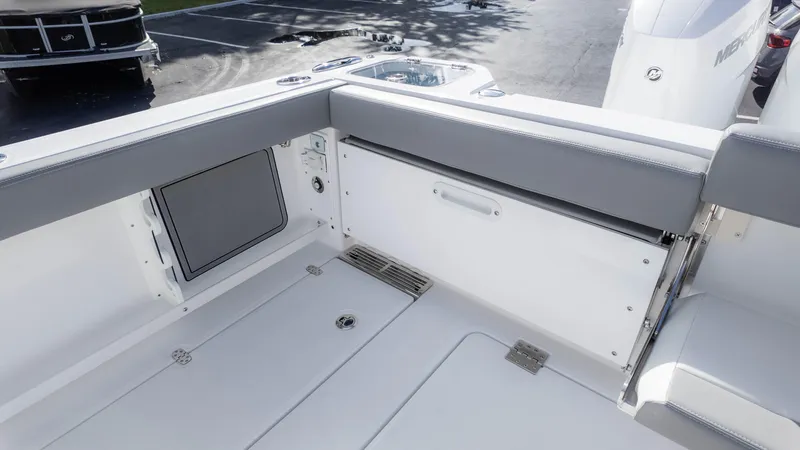 Slide: The Image of 2025 Everglades 315 Center Console boat interior with seating and storage. - 12