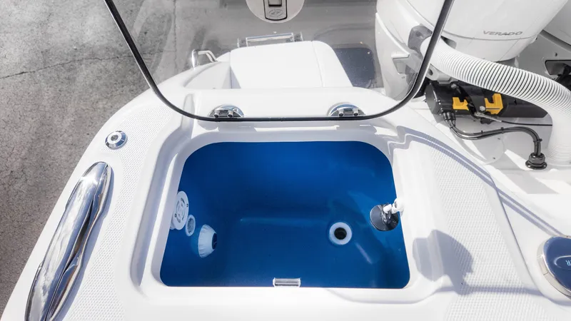 Slide: The Image of 2025 Everglades 315 Center Console livewell with blue interior and white exterior. - 16