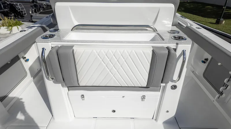 Slide: The Image of 2025 Everglades 315 Center Console boat interior with sleek seating and storage. - 18