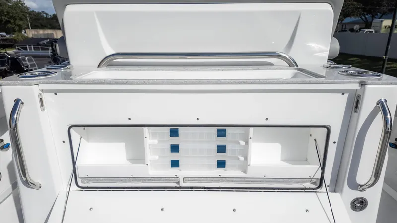 Slide: The Image of 2025 Everglades 315 Center Console boat storage compartment with sleek design and stainless steel handles. - 19