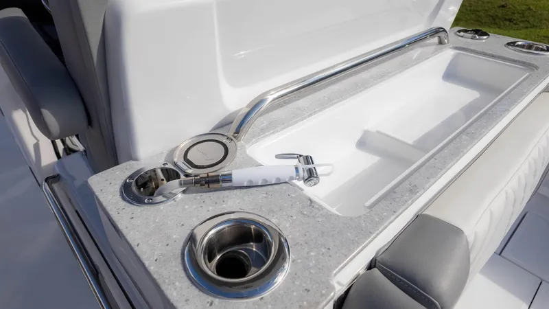Slide: The Image of 2025 Everglades 315 Center Console boat interior with cup holders and seating. - 20