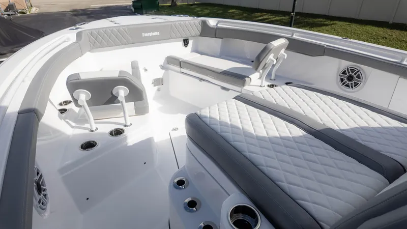 Slide: The Image of 2025 Everglades 315 Center Console boat interior with cushioned seating and modern design. - 27
