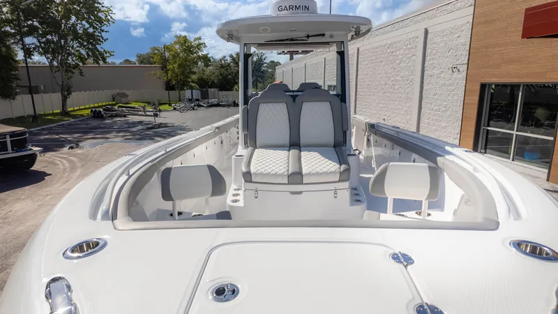 Slide: The Image of 2025 Everglades 315 Center Console boat, sleek design, spacious seating, outdoor setting. - 3
