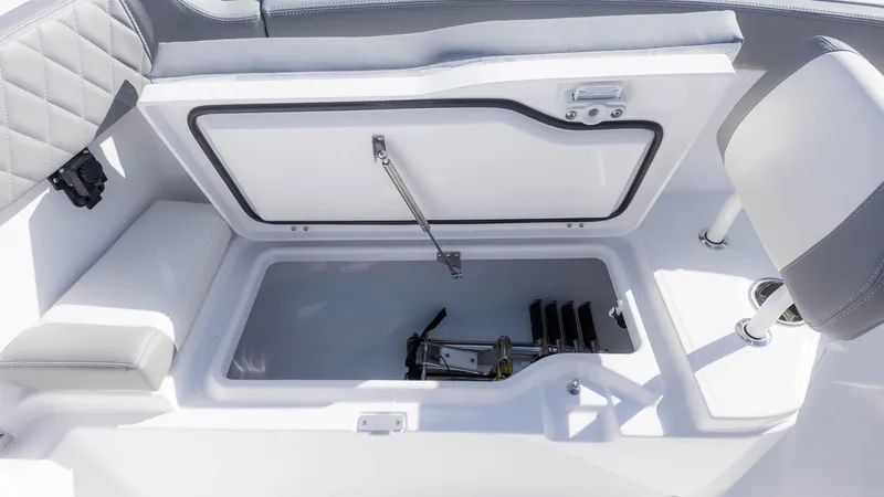 Slide: The Image of 2025 Everglades 315 Center Console storage compartment with open lid and seating. - 31